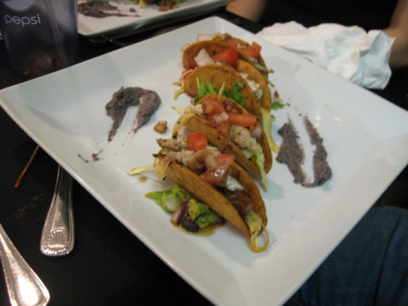 Mahi-Mahi tacos, chipotle infused guacamole, habanero-parsnip slaw, cilantro pico de gallo, and black bean puree