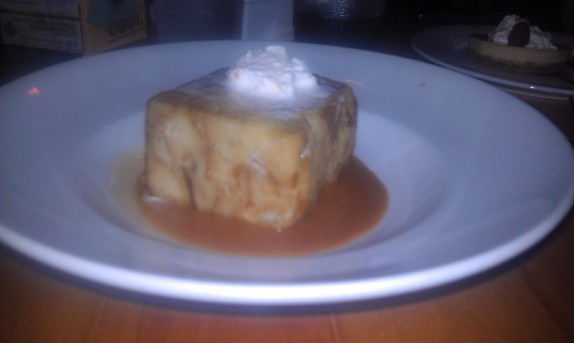 Bourbon Bread Pudding Cooked with bananas and white chocolate, finished with a bourbon caramel sauce topped with fresh whipped cream