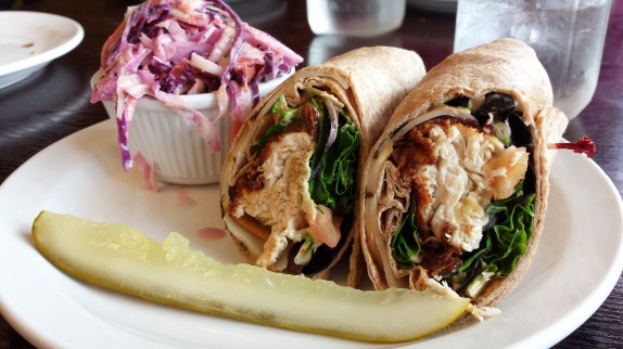 Crispy Chipotle Chicken Wrap $10 All natural chicken fried to order chicken breast, local field greens, tomatoes, black olives, smoked mozzarella, balsamic vinaigrette and chipotle mayo on a NY wheat wrap; with potato salad or cole slaw