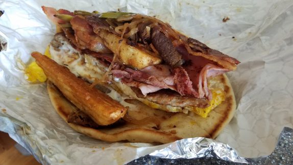 EJ Grande (warm pita with 2 eggs, sauteed onions, green peppers, home fries, cheese, bacon, ham, sausage, and gyro meat)